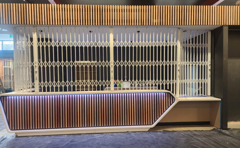 Folding Security Gates are ideal for securing curved and angled  counter tops, benchtops, serveries and reception desks