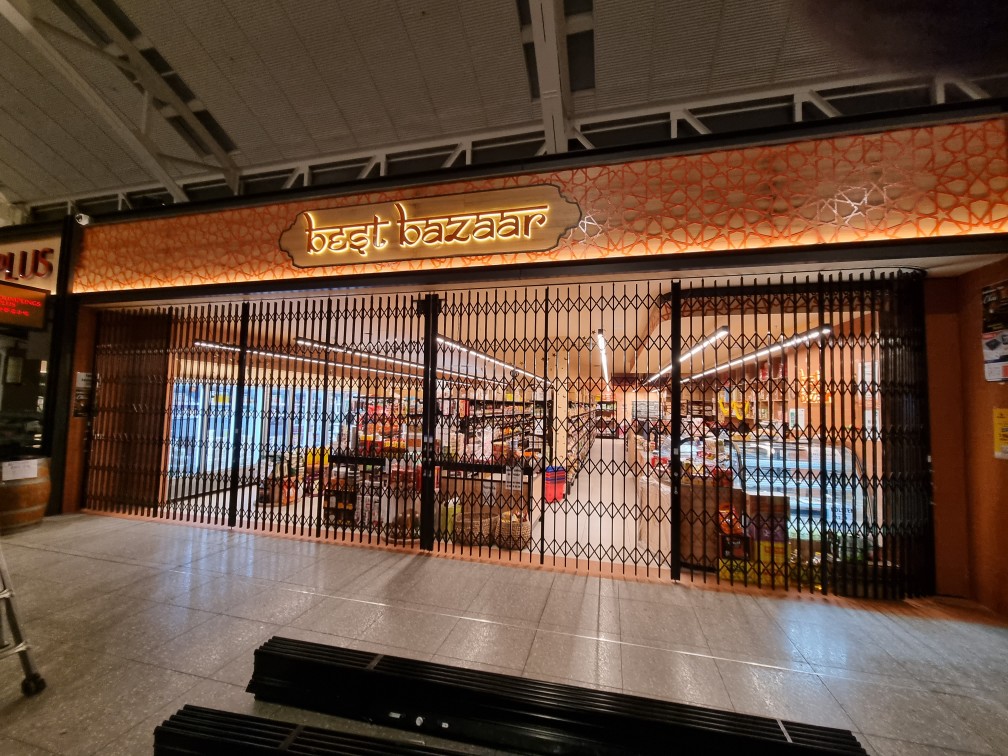 Folding Security Trellis Doors for Curved Shopfronts Australia