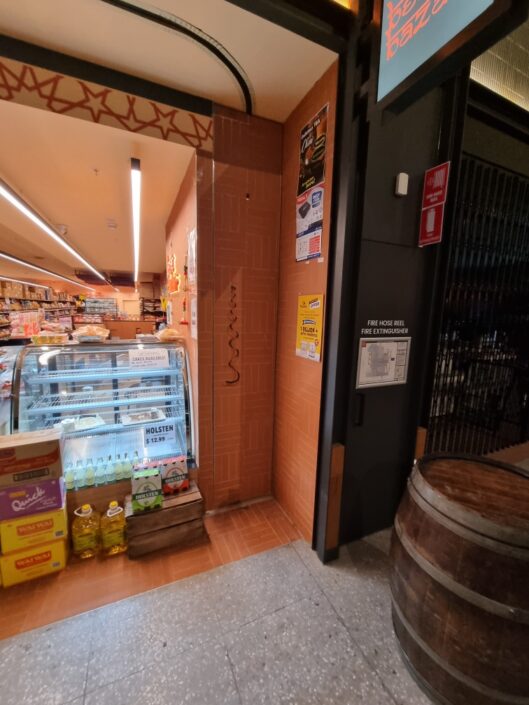 Folding Security Trellis Doors for Curved Shopfronts Australia