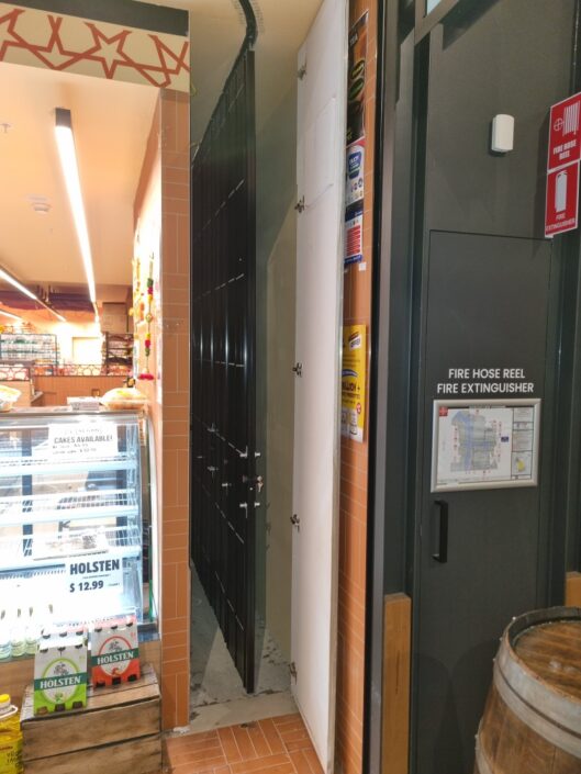 Folding Security Trellis Doors for Curved Shopfronts Australia